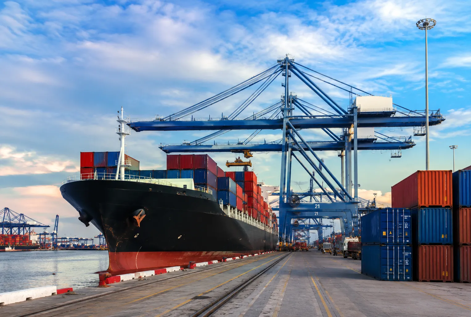 Container ship and cargo cranes at an international shipping port